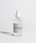 Clear bottle with a white cap labeled 'Wildflower Nectar' on a light gray background