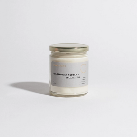 Candle jar with a label on a white background