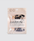 Packaged eco-friendly creaseless clips with visible branding on a white background