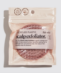 Package of a scalp exfoliator with text on a light background