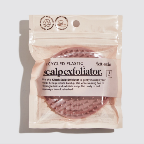 Package of a scalp exfoliator with text on a light background