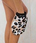 Leopard print glove with 'kit-sch' branding on a neutral background
