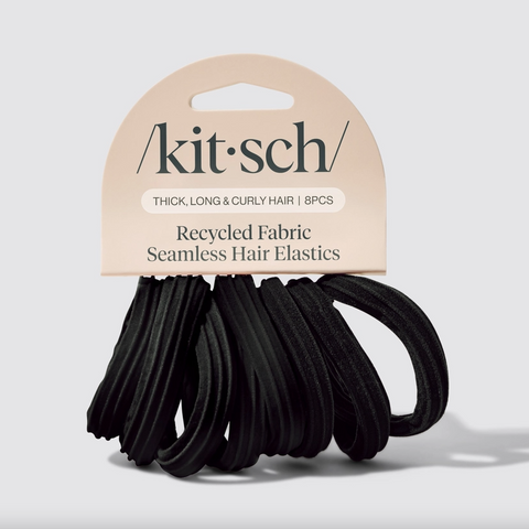 Pack of black hair elastics with 'kit&sch' branding on a light gray background