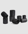 Set of black hair curlers on a light gray background