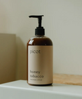 Skincare bottle labeled 'picot' on a white surface with a neutral background