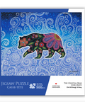 Jigsaw puzzle packaging with a bear design on a blue background