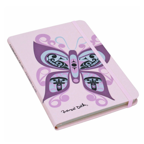 Notebook with butterfly design on a pink background