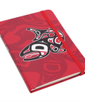 Red notebook with a black and white design on a white background