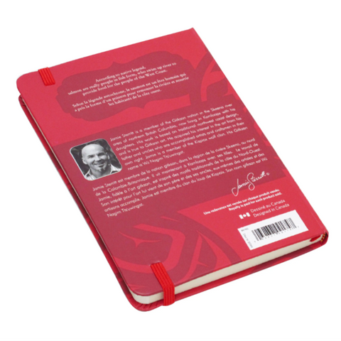 Red book with a visible author's name on a white background