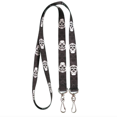 Black lanyard with white skull patterns on a white background