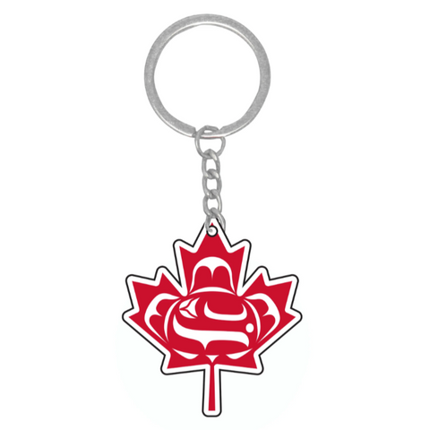 Keychain with red maple leaf design on a white background