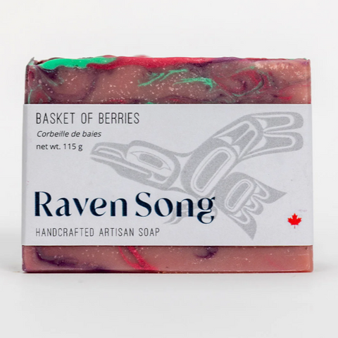 Handcrafted artisan soap bar with 'Raven Song' branding on a white background