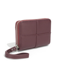 Purple wallet with strap on a white background, featuring vegan leather label.