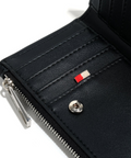 Close-up of a black wallet with a zipper and visible brand logo on a white background.