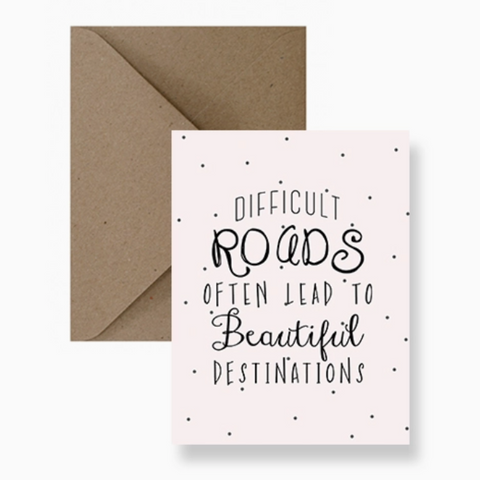 Greeting card with motivational quote and brown envelope on a white background