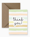Greeting card with 'thank you!' text and striped design, accompanied by a brown envelope on a white background.