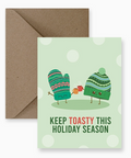 Greeting card with cartoon mittens and envelope on a light green background