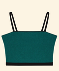 Green crop top with black straps on a beige background