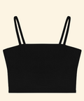 Black crop top with thin straps on a beige background