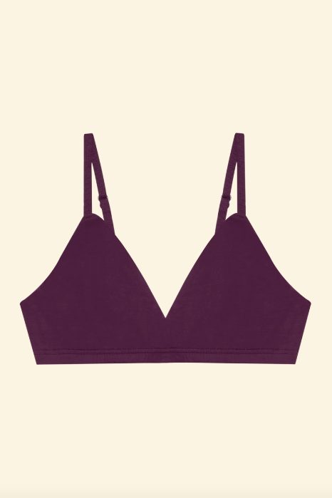 Purple bralette on a beige background