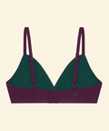 Green and purple bra on a beige background