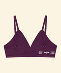 Purple bra with thin straps on a beige background