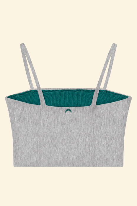 Gray tank top with teal lining on a beige background