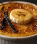 Creme bréleé with a banana slice and vanilla bean on top