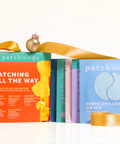 Patchology product packaging with colorful boxes and gold ribbons on a white background