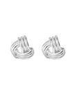 Pair of silver knot earrings on a white background