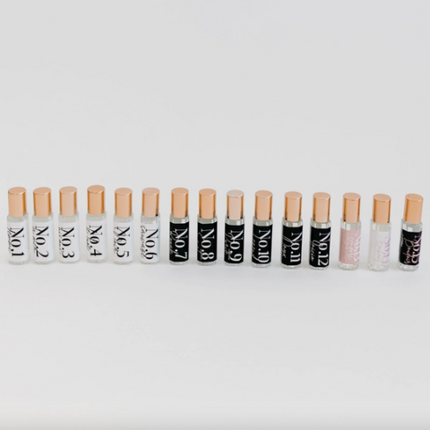 Row of lip balm tubes with visible brand names on a white background