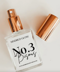 Perfume bottle labeled 'No. 3 Bisous' by Kindred Glow on a light background