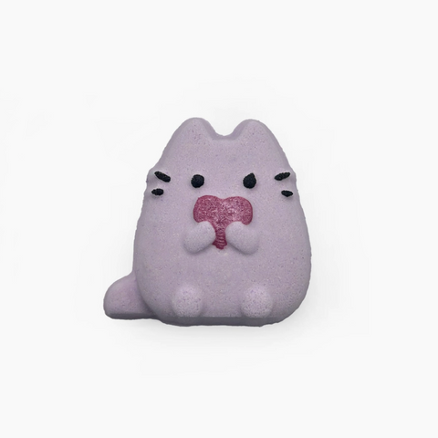 Plush toy resembling a cat with a pink heart on a white background
