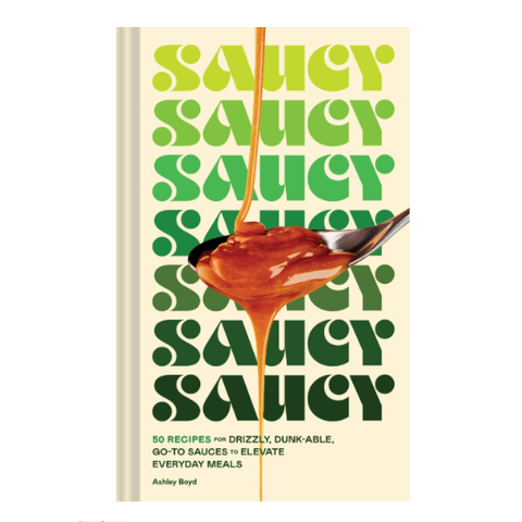 Book cover of 'Saucy' with a spoonful of sauce on a white background