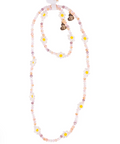 Beaded necklace with small flowers on a white background
