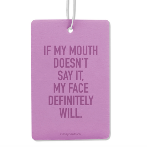 Purple air freshener with humorous text on a white background