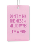 Pink card with humorous text 'Don't mind the mess & meltdowns...I'm a mom' on a white background.