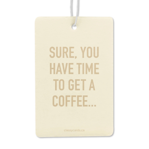 Cream-colored card with gold text 'SURE, YOU HAVE TIME TO GET A COFFEE...' on a white background