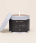 Candle in a tin labeled 'Raven Song' on a beige background