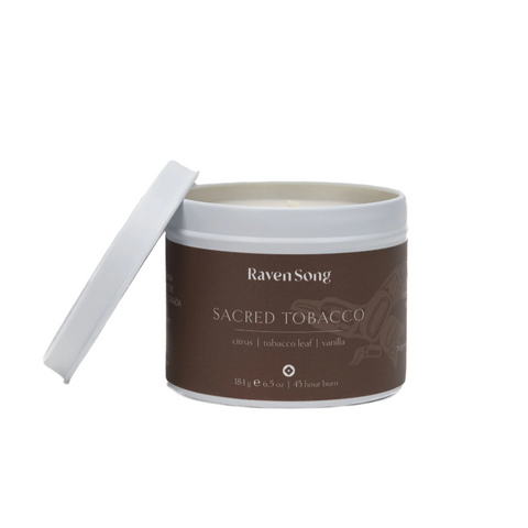 Candle jar labeled 'Raven Song Sacred Tobacco' on a white background