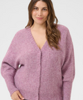 Woman wearing a pink cardigan on a website page