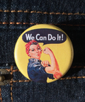 Button with Rosie the Riveter design on a denim background