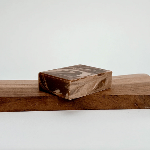 Wooden block with a marbled pattern on a wooden surface