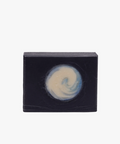 Bar of soap with a black box on a white background