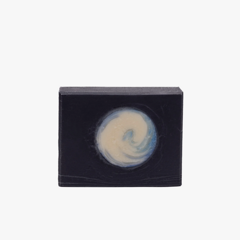 Bar of soap with a black box on a white background