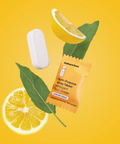 Naturebee multi-purpose spray tablet with lemon slices and leaves on a yellow background