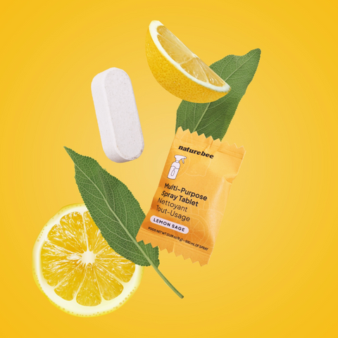 Naturebee multi-purpose spray tablet with lemon slices and leaves on a yellow background