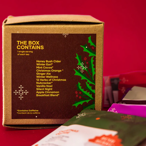 Tea box with holiday-themed packaging on a red background