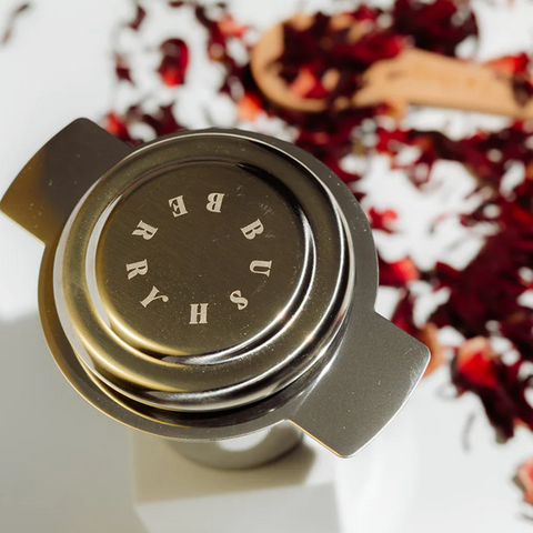 Tea infuser with brand name on a white background