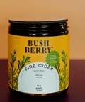 Jar of Bush Berry Fire Cider on a gradient background